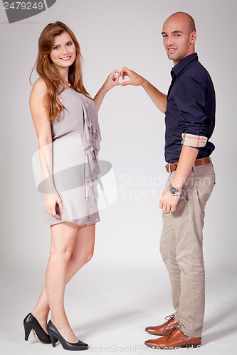 Image of young attractive couple in love embracing portrait