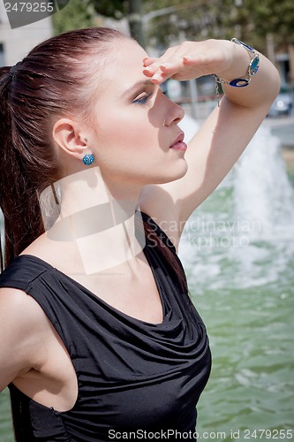 Image of attractive brunette young woman in summer outdoor 