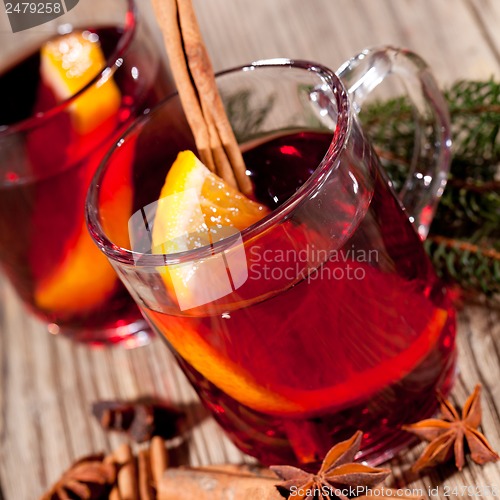 Image of hot tasty spicy mulled red wine with orange and cinnamon christmas 