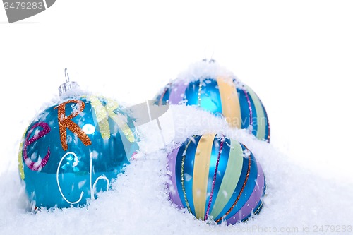 Image of christmas decoration baubles in blue and turquoise isolated