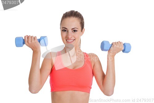 Image of healthy smiling girl workout with dumbbell isolated 