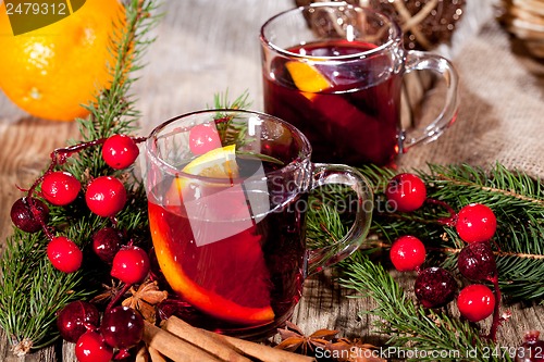 Image of hot tasty spicy mulled red wine with orange and cinnamon christmas 