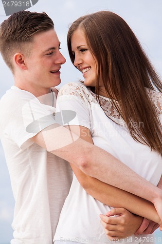 Image of attractive young couple in love having fun in summer holidays