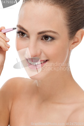 Image of youtg beautiful woman eyebrow plucking tweezers eyes hair 