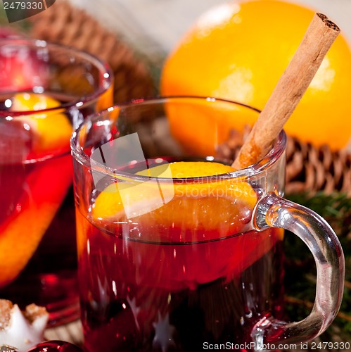 Image of hot tasty spicy mulled red wine with orange and cinnamon christmas 