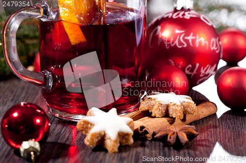 Image of hot tasty spicy mulled red wine with orange and cinnamon christmas 