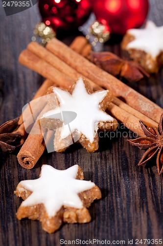 Image of fresh tasty christmas cinnamon cookies and sticks decoration 