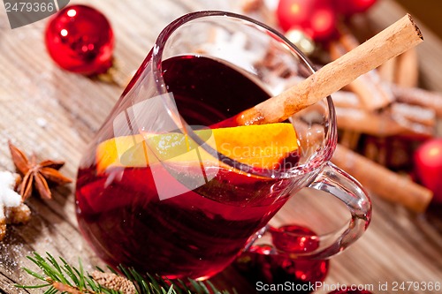 Image of hot tasty spicy mulled red wine with orange and cinnamon christmas 