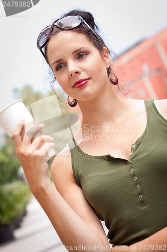 Image of attractive woman with sunglasses in the city summertime