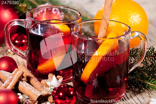 Image of hot tasty spicy mulled red wine with orange and cinnamon christmas 