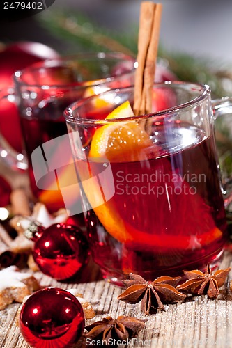 Image of hot tasty spicy mulled red wine with orange and cinnamon christmas 