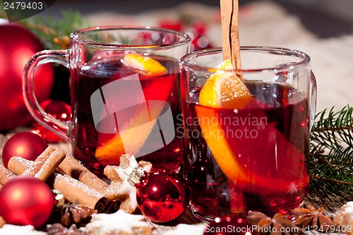 Image of hot tasty spicy mulled red wine with orange and cinnamon christmas 