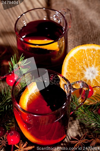 Image of hot tasty spicy mulled red wine with orange and cinnamon christmas 