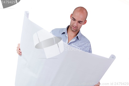 Image of young adult businessman architect with blueprint 