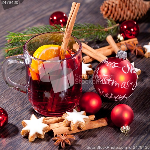 Image of hot tasty spicy mulled red wine with orange and cinnamon christmas 