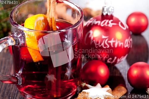 Image of hot tasty spicy mulled red wine with orange and cinnamon christmas 