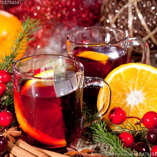 Image of hot tasty spicy mulled red wine with orange and cinnamon christmas 