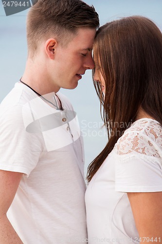 Image of attractive young couple in love having fun in summer holidays