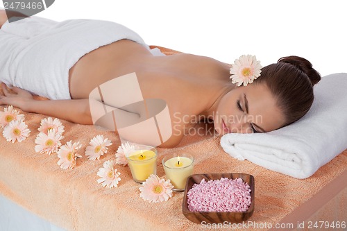 Image of attractive healthy caucasian woman hot stone massage wellness 