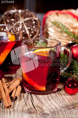 Image of hot tasty spicy mulled red wine with orange and cinnamon christmas 