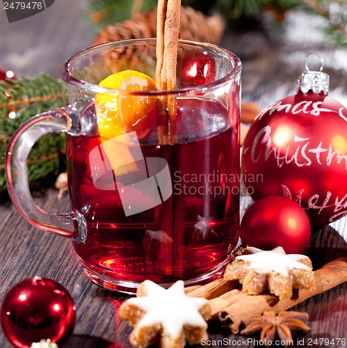 Image of hot tasty spicy mulled red wine with orange and cinnamon christmas 