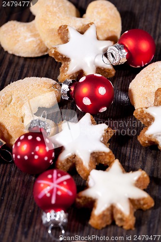 Image of fresh tasty christmas cinnamon cookies and sticks decoration 