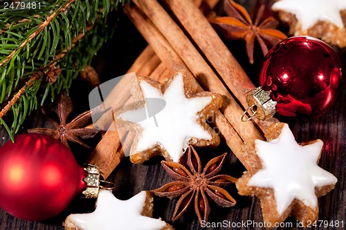 Image of fresh tasty christmas cinnamon cookies and sticks decoration 