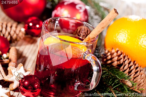 Image of hot tasty spicy mulled red wine with orange and cinnamon christmas 