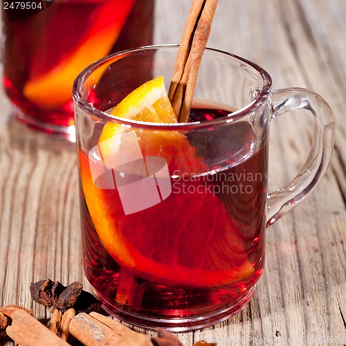 Image of hot tasty spicy mulled red wine with orange and cinnamon christmas 