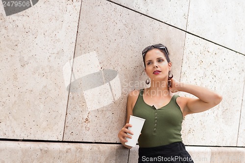 Image of attractive young woman with  sunglasses outdoor