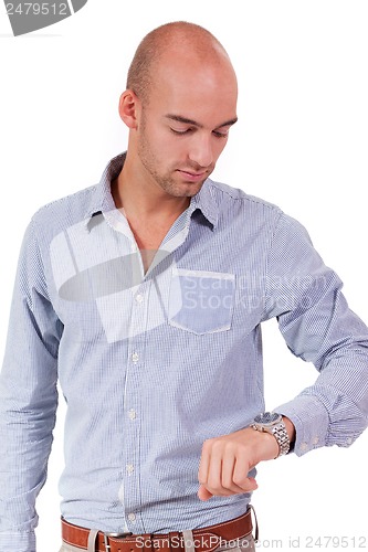 Image of young adult business man looking at watch portrait