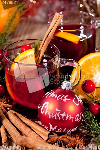 Image of hot tasty spicy mulled red wine with orange and cinnamon christmas 