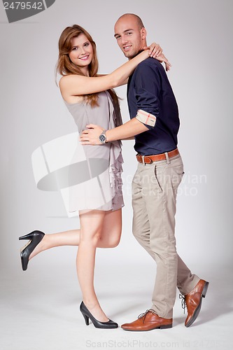 Image of young attractive couple in love embracing portrait