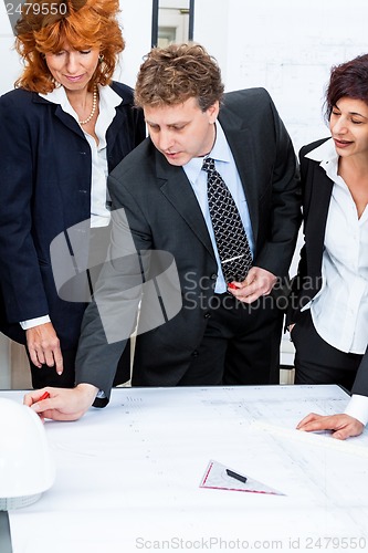Image of business people discussing architecture plan sketch 