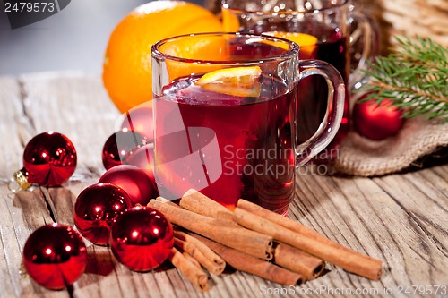 Image of hot tasty spicy mulled red wine with orange and cinnamon christmas 