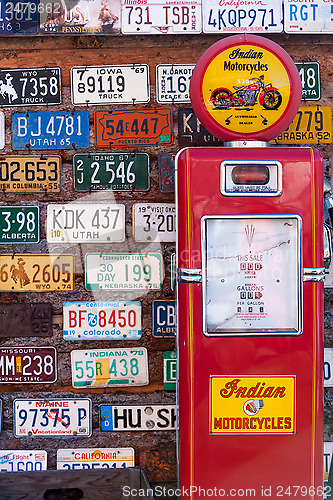 Image of Old license plates and gas pump