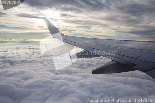 Image of Sunset, clouds and wing