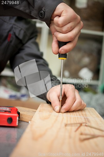 Image of Man with screwdriver