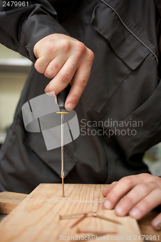 Image of Man with screwdriver