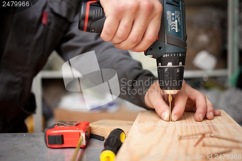 Image of Man with screwdriver