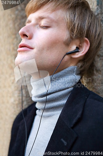 Image of listening to music with earphones