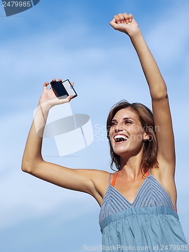 Image of happy woman with mobile phone