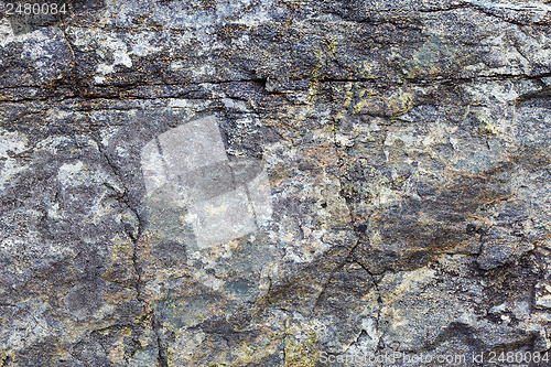 Image of Granite rock with stains and cracks - a natural background