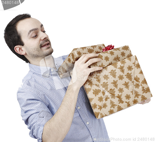 Image of Young man holding a present