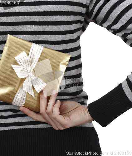 Image of Young woman holding a present