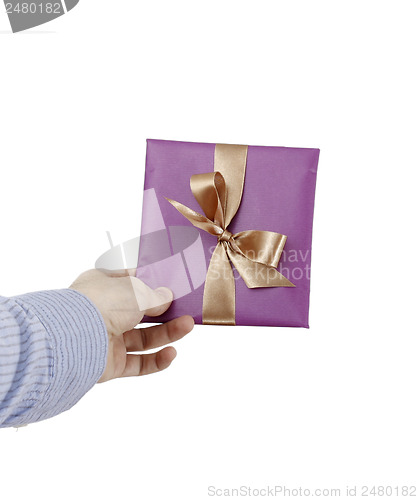 Image of Young man holding a present
