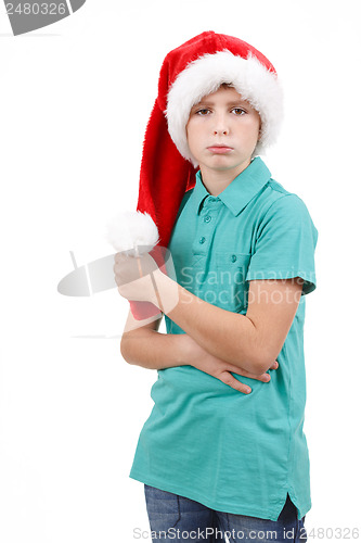 Image of bored teenager wit red santa hat