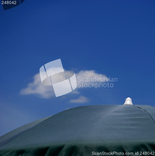 Image of Beach Umbrella And Sky Detail