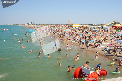 Image of Many People Relaxing On The Beach