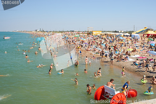Image of Many People Relaxing On The Beach